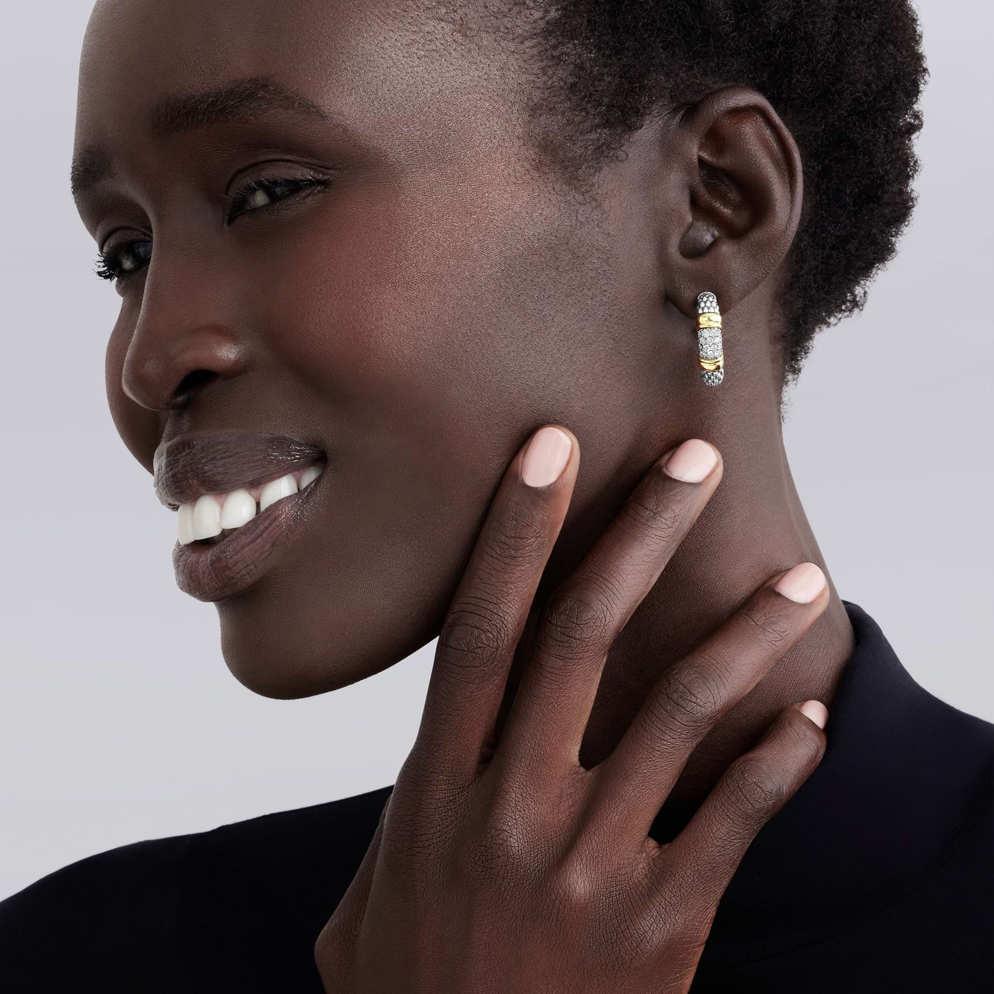 Signature Caviar Two-Tone Diamond Hoop Earrings featuring yellow and white metal tones with caviar-beaded texture and pavé diamond accents; sculptural, lightweight design for modern luxury and versatile wear.
